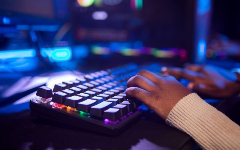 A person Using the keyboard in low lit area